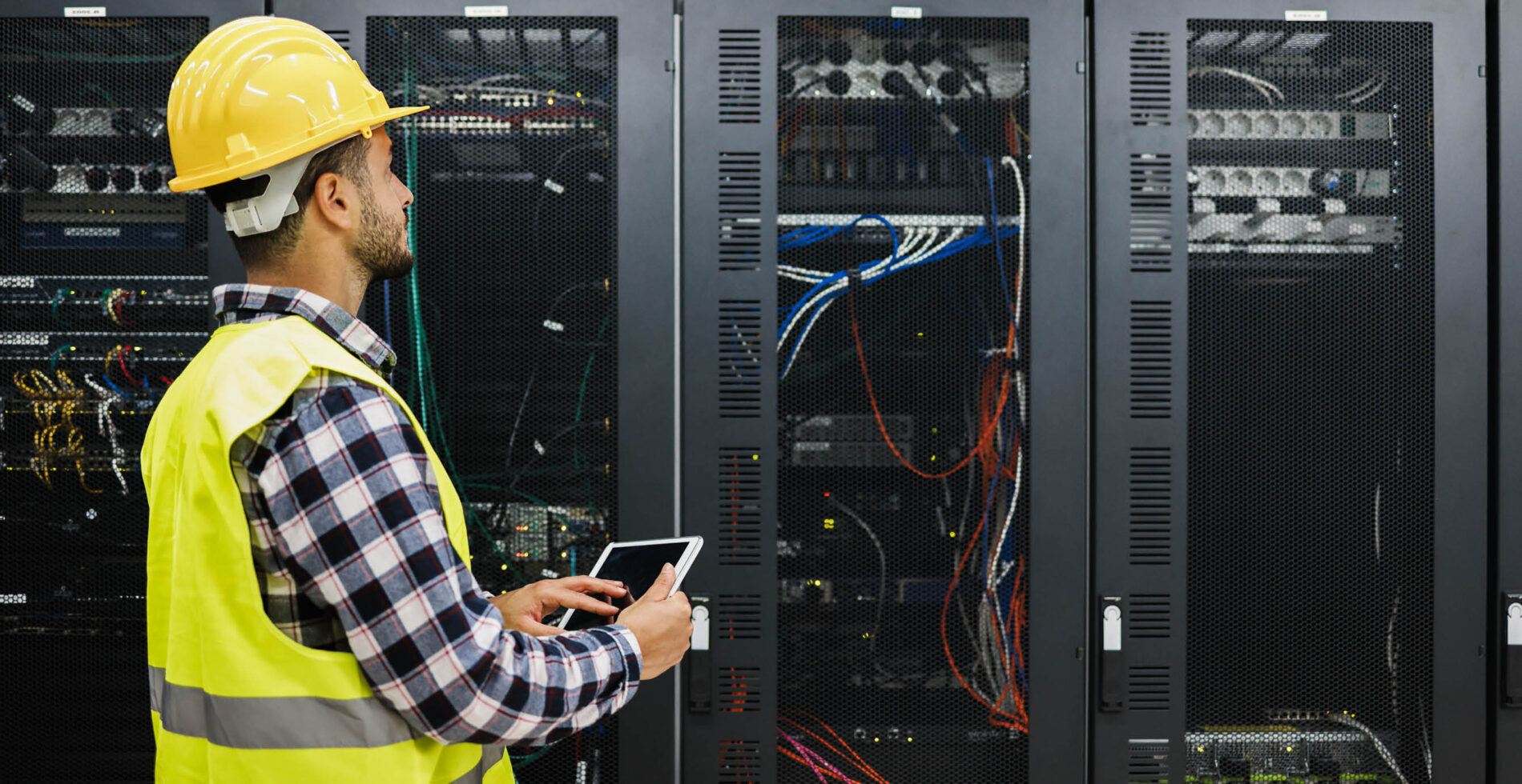 Man standing in front of a  modern infrastructure system 